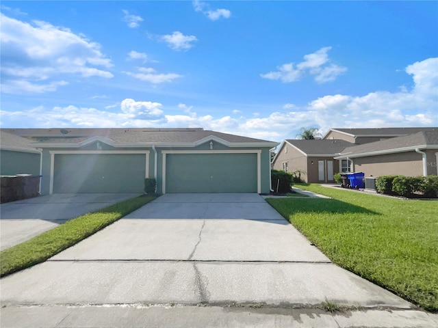 ranch-style house with a garage and a front yard