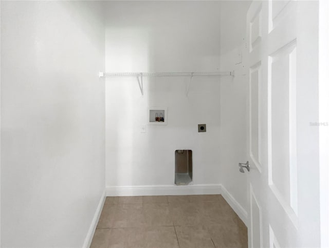 laundry area featuring washer hookup, light tile patterned flooring, and electric dryer hookup