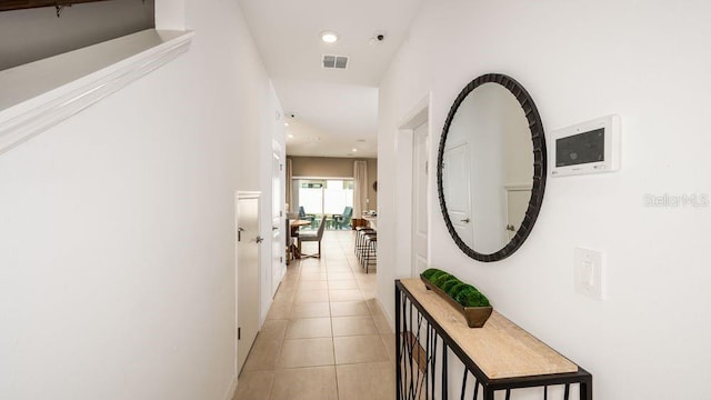 hallway with light tile patterned floors