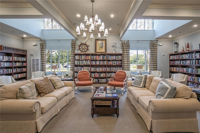 living room featuring a high ceiling and ornamental molding