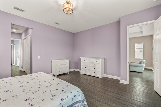 bedroom with dark hardwood / wood-style flooring