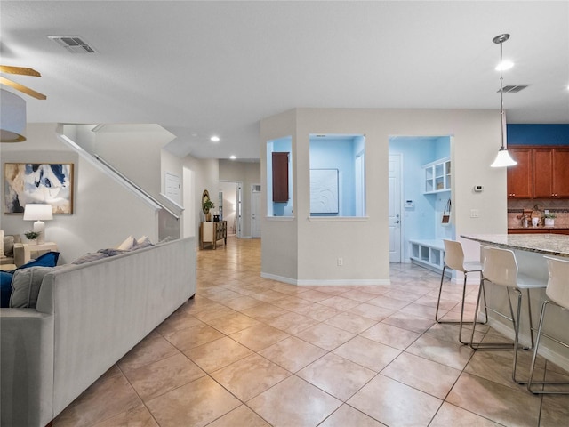 living room with light tile patterned floors