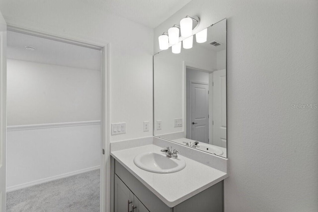 bathroom with visible vents and vanity