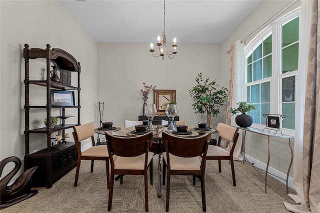 dining space with a chandelier