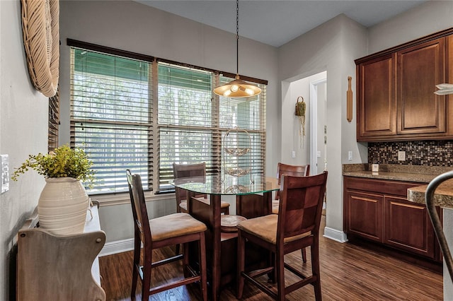 dining room featuring dark hardwood / wood-style flooring