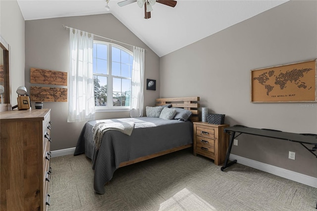 bedroom with ceiling fan, vaulted ceiling, and carpet