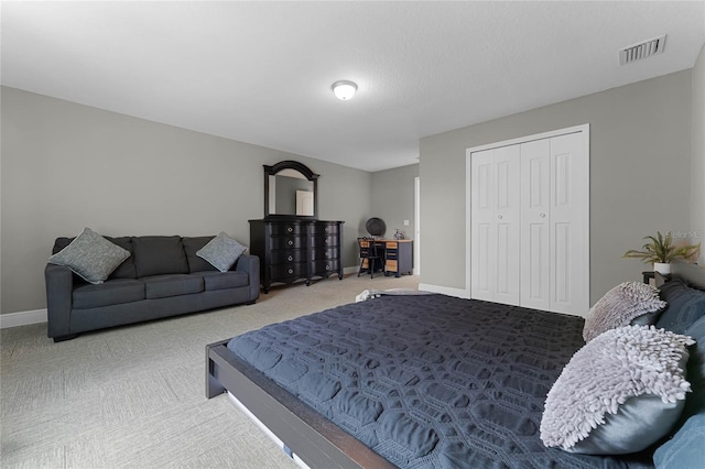 carpeted bedroom featuring a closet