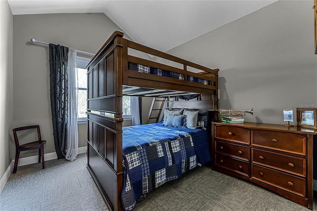 carpeted bedroom with vaulted ceiling