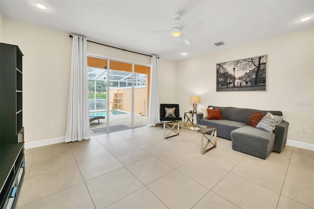 living room with light tile patterned floors and ceiling fan