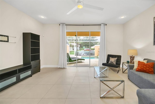 tiled living room featuring ceiling fan