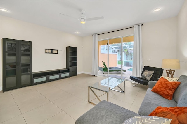 living room featuring ceiling fan and light tile patterned floors