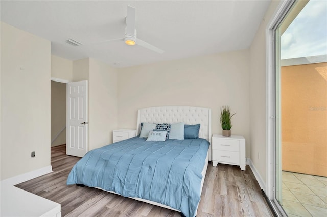 bedroom with ceiling fan and light hardwood / wood-style flooring