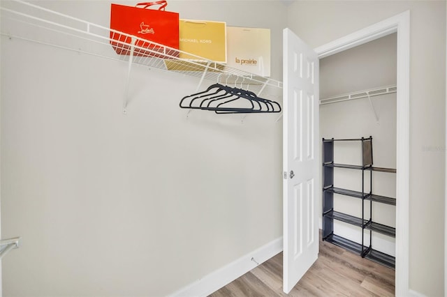 walk in closet featuring hardwood / wood-style floors