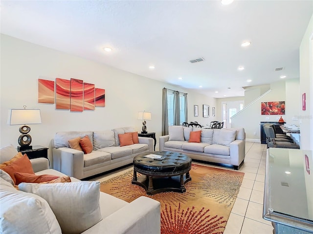 living room with light tile patterned flooring