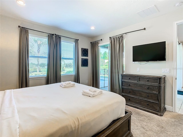 carpeted bedroom featuring access to exterior