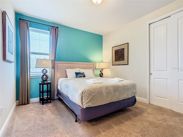 bedroom with carpet floors and a closet