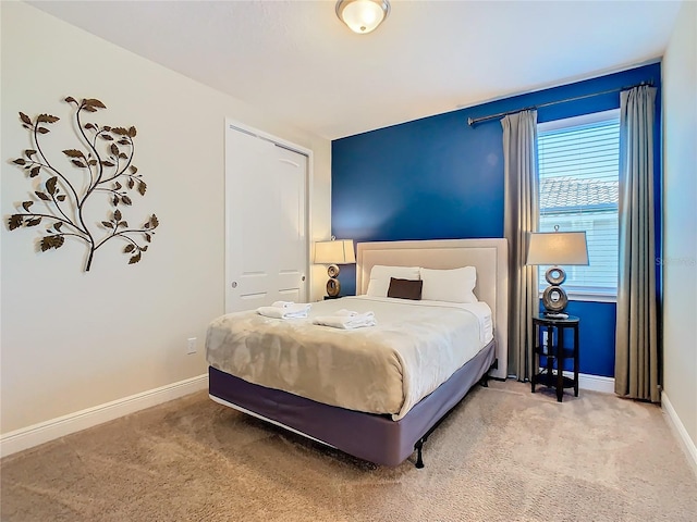 bedroom featuring a closet and carpet flooring