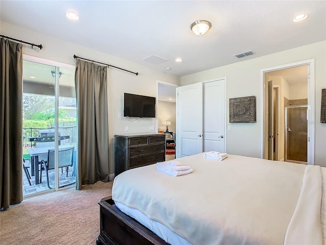 bedroom featuring light carpet, ensuite bathroom, a closet, and access to exterior