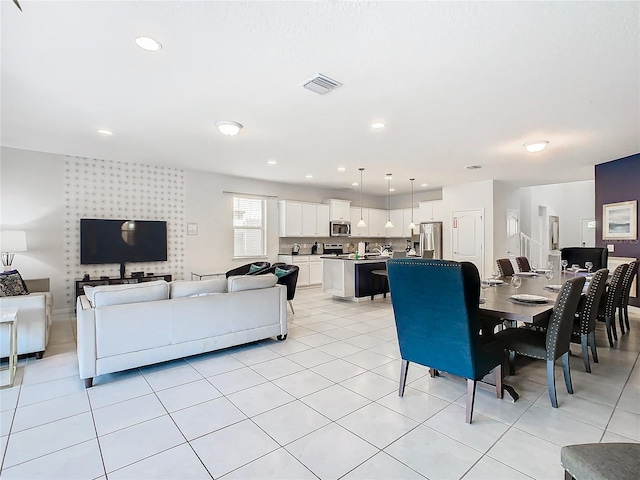 dining space with light tile patterned flooring