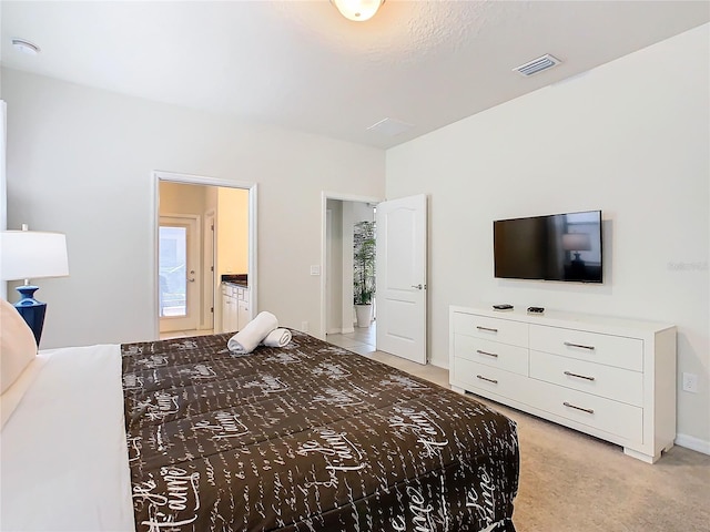 bedroom with light colored carpet