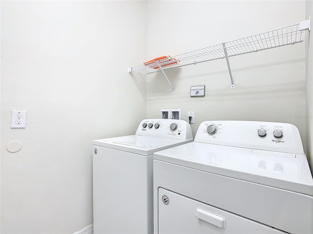 laundry room with separate washer and dryer