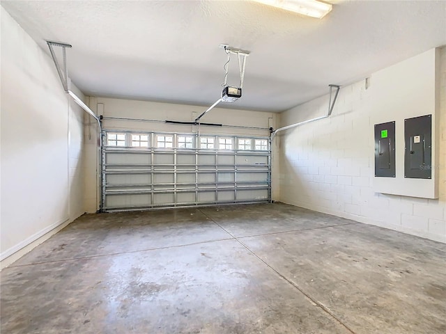 garage featuring a garage door opener and electric panel