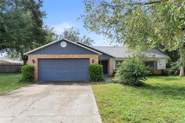 ranch-style home with a garage and a front lawn