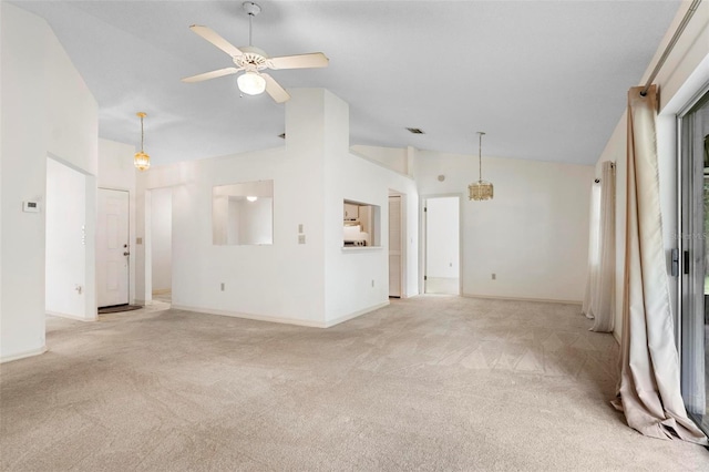 unfurnished living room featuring light carpet, vaulted ceiling, and ceiling fan