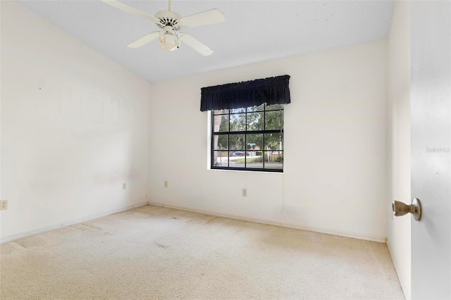 spare room with ceiling fan and carpet flooring