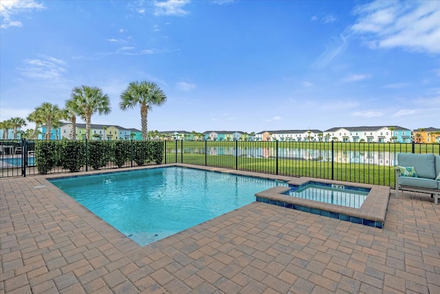 view of pool featuring an in ground hot tub and a patio area