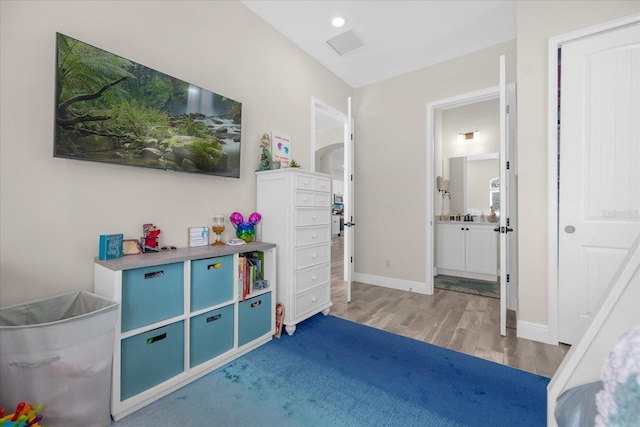 playroom with hardwood / wood-style flooring