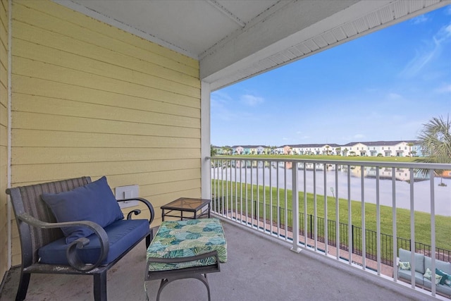 balcony featuring a water view