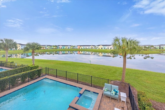 view of swimming pool with a water view, a yard, an in ground hot tub, and a patio