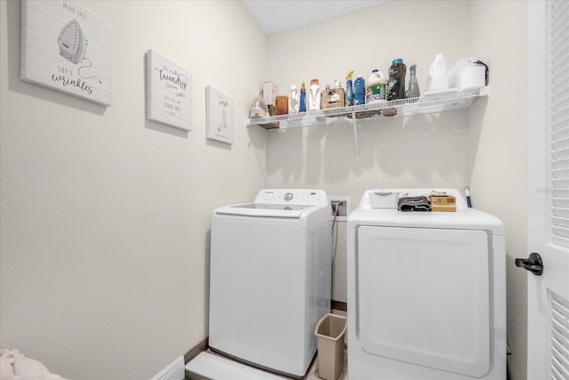 washroom with independent washer and dryer