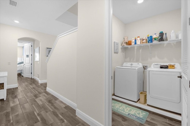 washroom with washing machine and clothes dryer