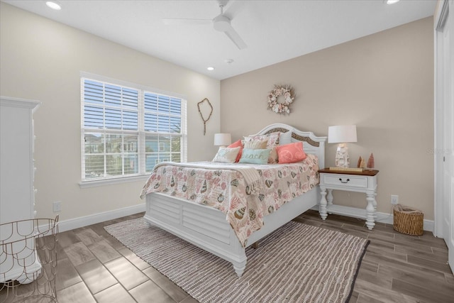 bedroom with wood-type flooring and ceiling fan