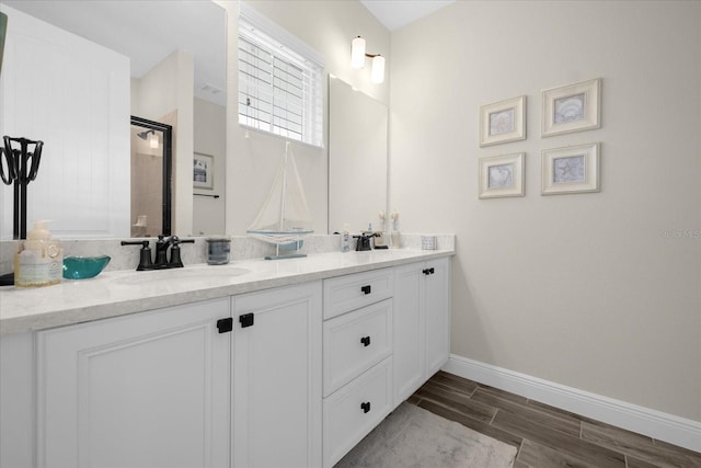 bathroom with vanity and an enclosed shower