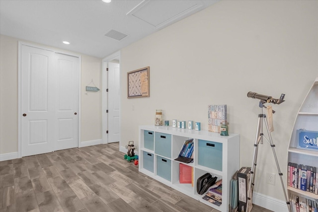 recreation room with hardwood / wood-style flooring