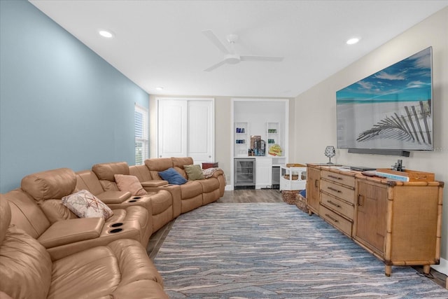 living room featuring wine cooler, ceiling fan, and dark hardwood / wood-style floors