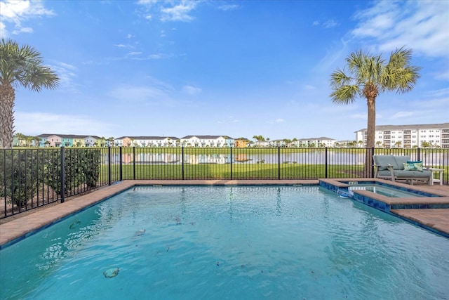 view of swimming pool featuring an in ground hot tub