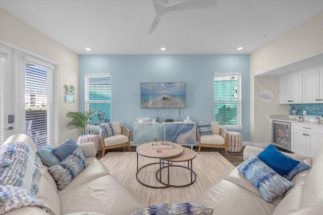 living room with hardwood / wood-style floors and beverage cooler