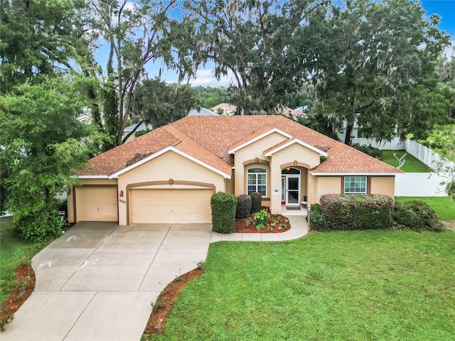 view of front of house featuring a garage and a front yard