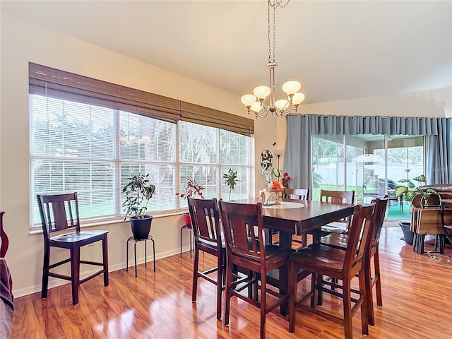 dining room featuring an inviting chandelier and hardwood / wood-style flooring