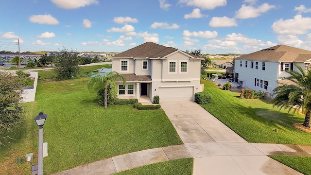 view of property featuring a garage and a front yard