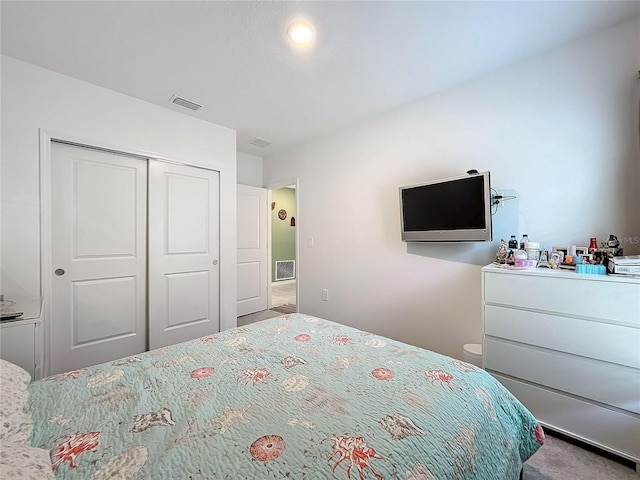 carpeted bedroom featuring a closet