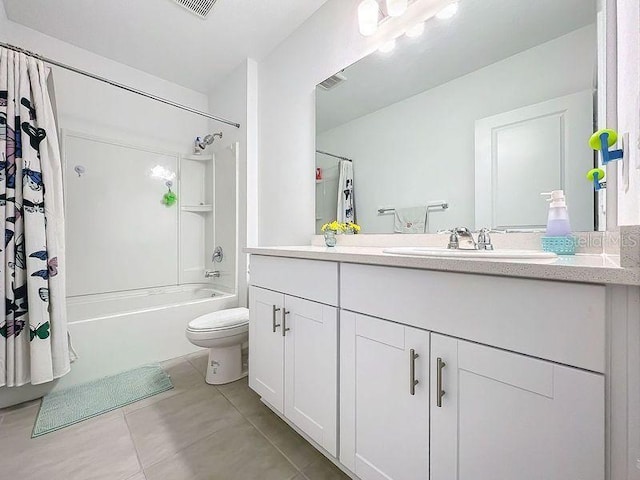 full bathroom featuring vanity, toilet, tile patterned floors, and shower / tub combo