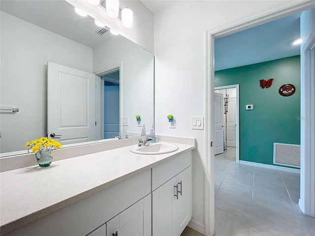 bathroom with vanity and tile patterned floors