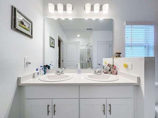 bathroom with vanity and walk in shower