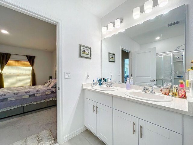 bathroom featuring vanity and walk in shower