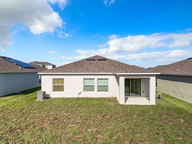 back of property featuring a yard and a patio